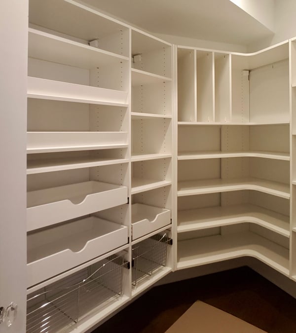 well-designed pantry with pullouts, wire baskets, corner radius shelves, and tray storage