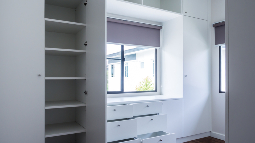 walk-in-closet-with-drawers-and-closet-doors